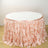 Pink ruffled table skirt draping around a circular table.