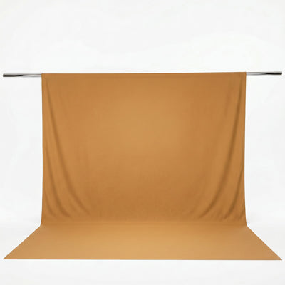 Tan seamless paper backdrop on studio background roll#whtbkgd