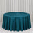 Teal round velvet tablecloth on banquet table with white curtain backdrop