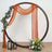 Circular display frame with draped fabric, flowers, and lanterns.