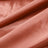 Textured rust-colored fabric with smooth, soft drapes. #whtbkgd