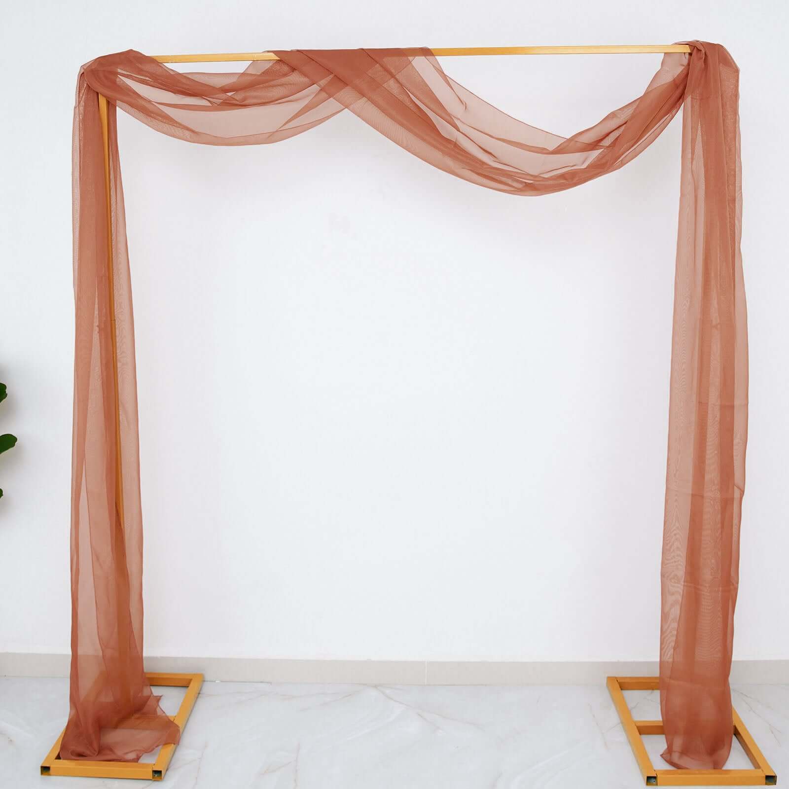 Terracotta sheer draping fabric for black and orange Halloween decor