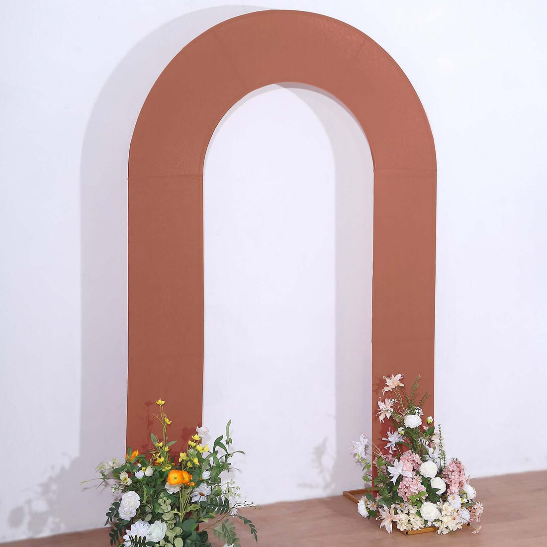 Brown arch decoration with floral arrangements at the base.