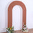 Brown arch decoration with floral arrangements at the base.