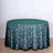 Round green floral tablecloth on a circular table.