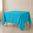 Turquoise wrinkle-resistant table overlay for square tables.