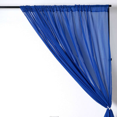 Blue sheer curtain draped elegantly on a black rod.