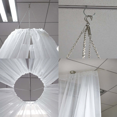 White sheer curtain hanging system with clips and chains