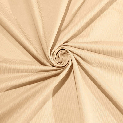 Beige textured fabric in a swirling pattern.