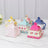 Colorful decorative tea box packaging in various floral designs.