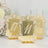 Elegant gold table number holders for weddings or events.