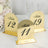 Gold table numbers for weddings or events, featuring numbers 11, 12, and 49.