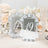 Elegant mirrored table number 19 with ornate design and floral backdrop.