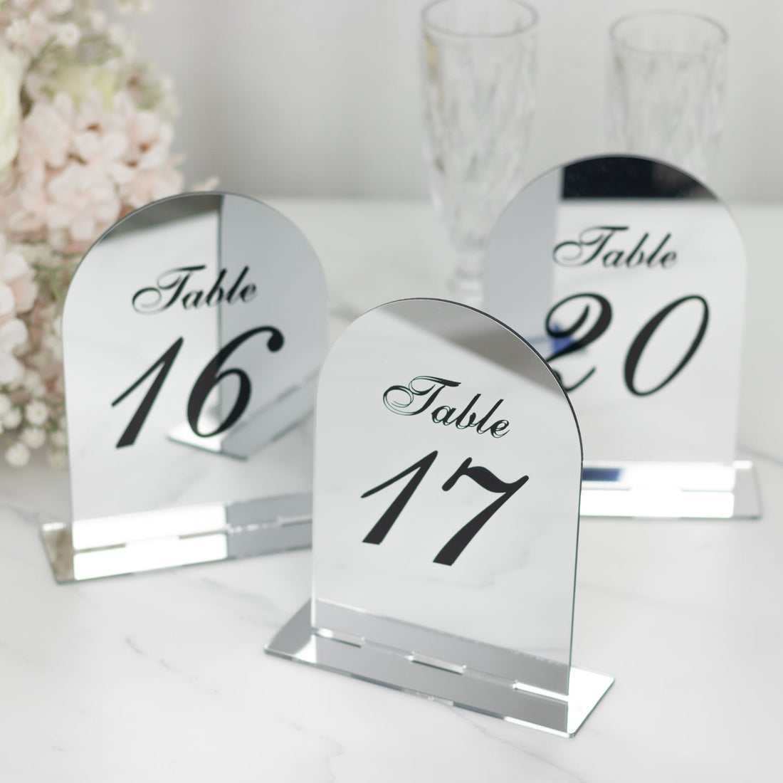 Mirrored table number holders showing numbers 16, 17, and 20.