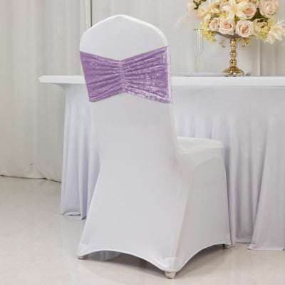 White banquet chair cover with purple velvet bow sash for elegant event decor