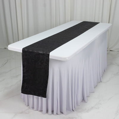 White banquet table with black table runner and pleated skirt, event decor