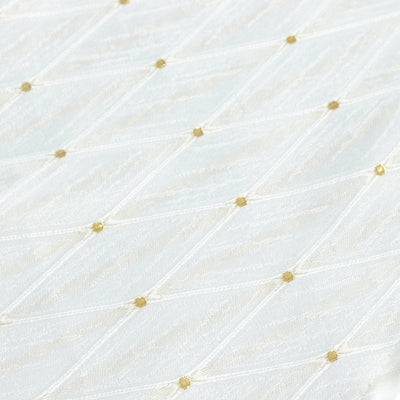 White fabric with delicate gold embroidered dot pattern#whtbkgd