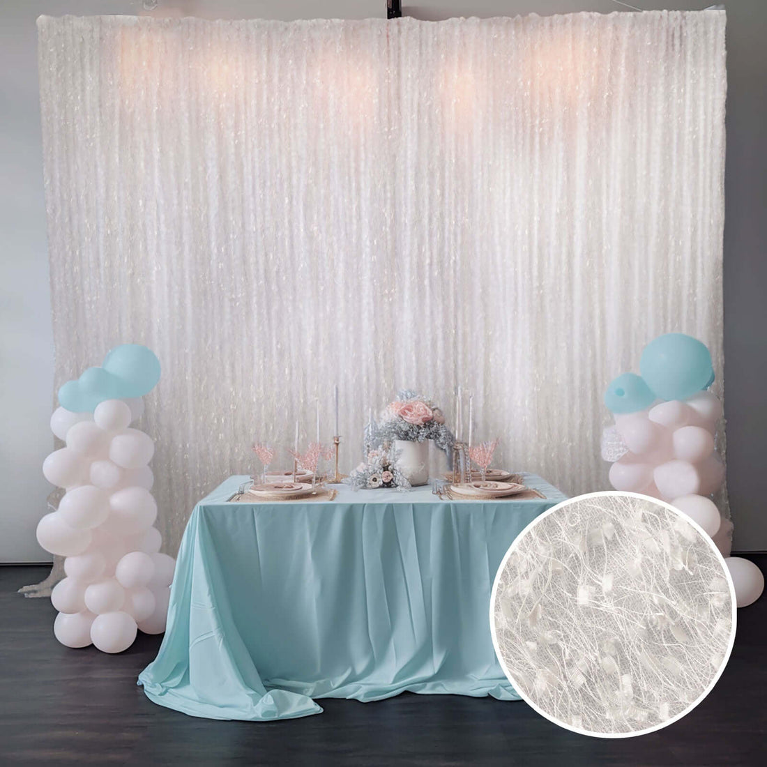 Elegant party backdrop with pastel balloons and table setting.