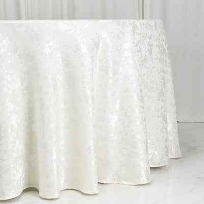 White jacquard round tablecloth draped elegantly over a table