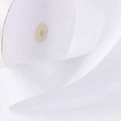 White modern pendant lamp close-up with curved shade and light bulb socket