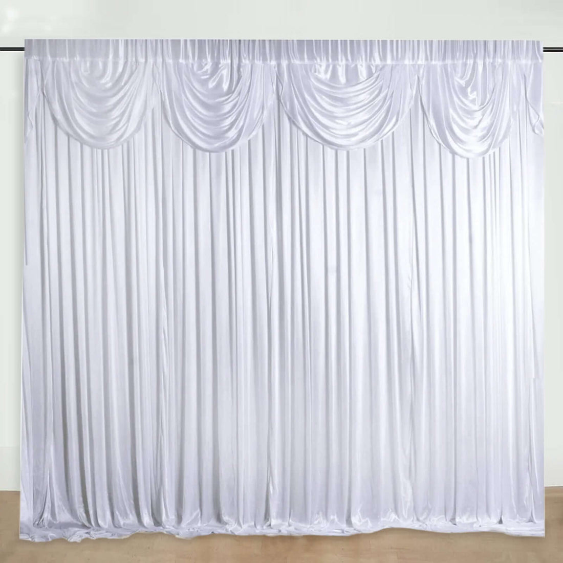White satin drapery backdrop with gathered detailing