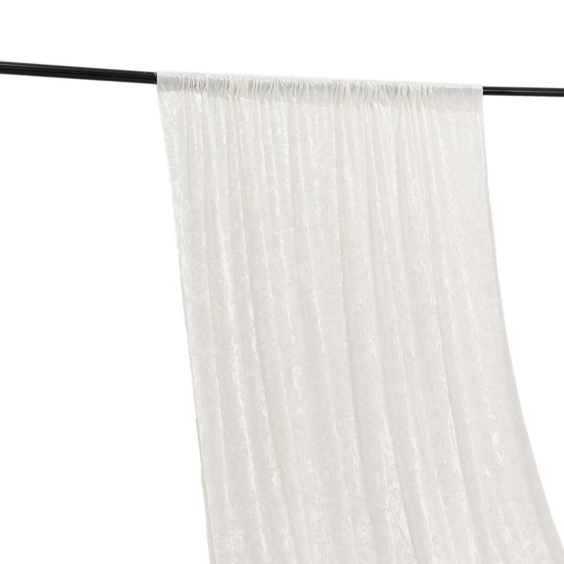 White sheer curtain draped on a rod, showcasing elegant texture and flow.