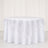 White round tablecloth with elegant layered overlay on a round table