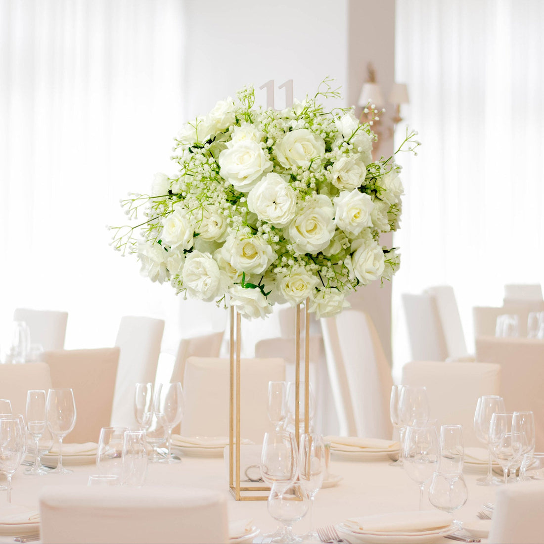 White silk floral arrangement for a church wedding altar