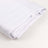 Folded white fabric sheet on a plain background.