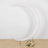White crescent moon backdrop with floral arrangement at the base
