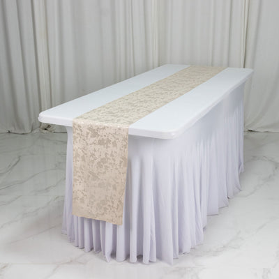White table with ivory patterned table runner and floor-length table skirt