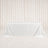 White tablecloth draped over rectangular table with elegant cream curtains