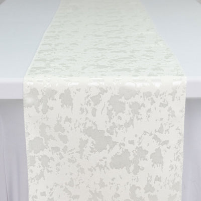 White textured fabric runner with subtle abstract pattern on a table
