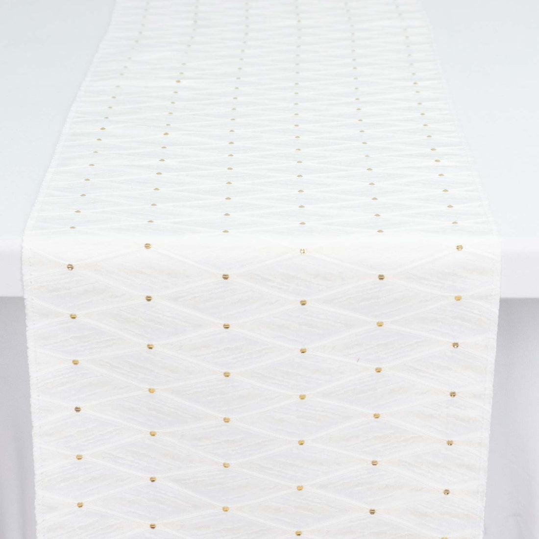 White woven ribbon with gold dotted pattern close-up