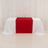 Red table runner on a white tablecloth in a studio setting.