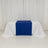 Blue table runner on a white table with draped linens