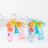 Colorful bubble guns in pink and blue against a white background.