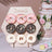 Colorful decorated donuts displayed on a stylish stand at a dessert table.