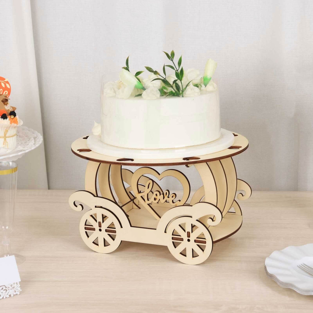 Wooden cake stand with heart design, perfect for weddings and celebrations.