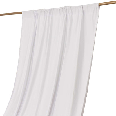 White curtain draped on a wooden rod against a plain background.