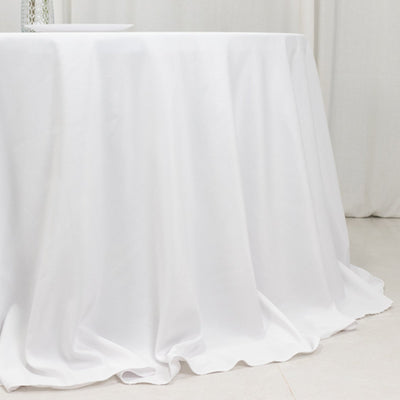 White tablecloth draping elegantly over a table.