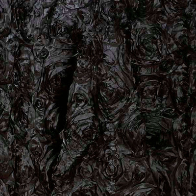 Textured black surface with a crumpled appearance.