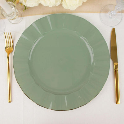 Green decorative plate with gold rim, styled with gold cutlery on a table setting.