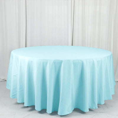 Round light blue tablecloth draped elegantly over a circular table.