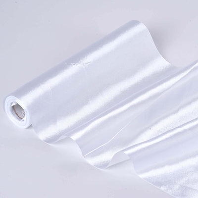 White satin fabric roll on a plain background