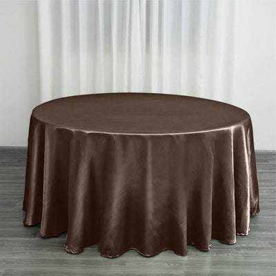 Brown round tablecloth draped over a table in a styled setting.