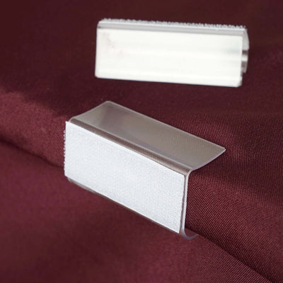 Clear plastic clips for fabric, ideal for securing materials.