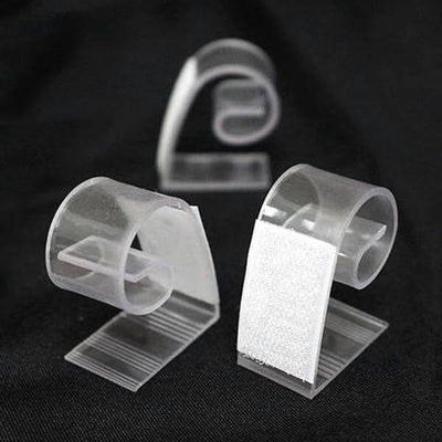 Clear plastic clips for organizing cables and wires.