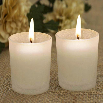 Set of two frosted glass candles with flames, perfect for ambiance.