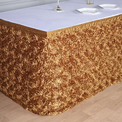 Gold rose-patterned table skirt with elegant texture for event decor.